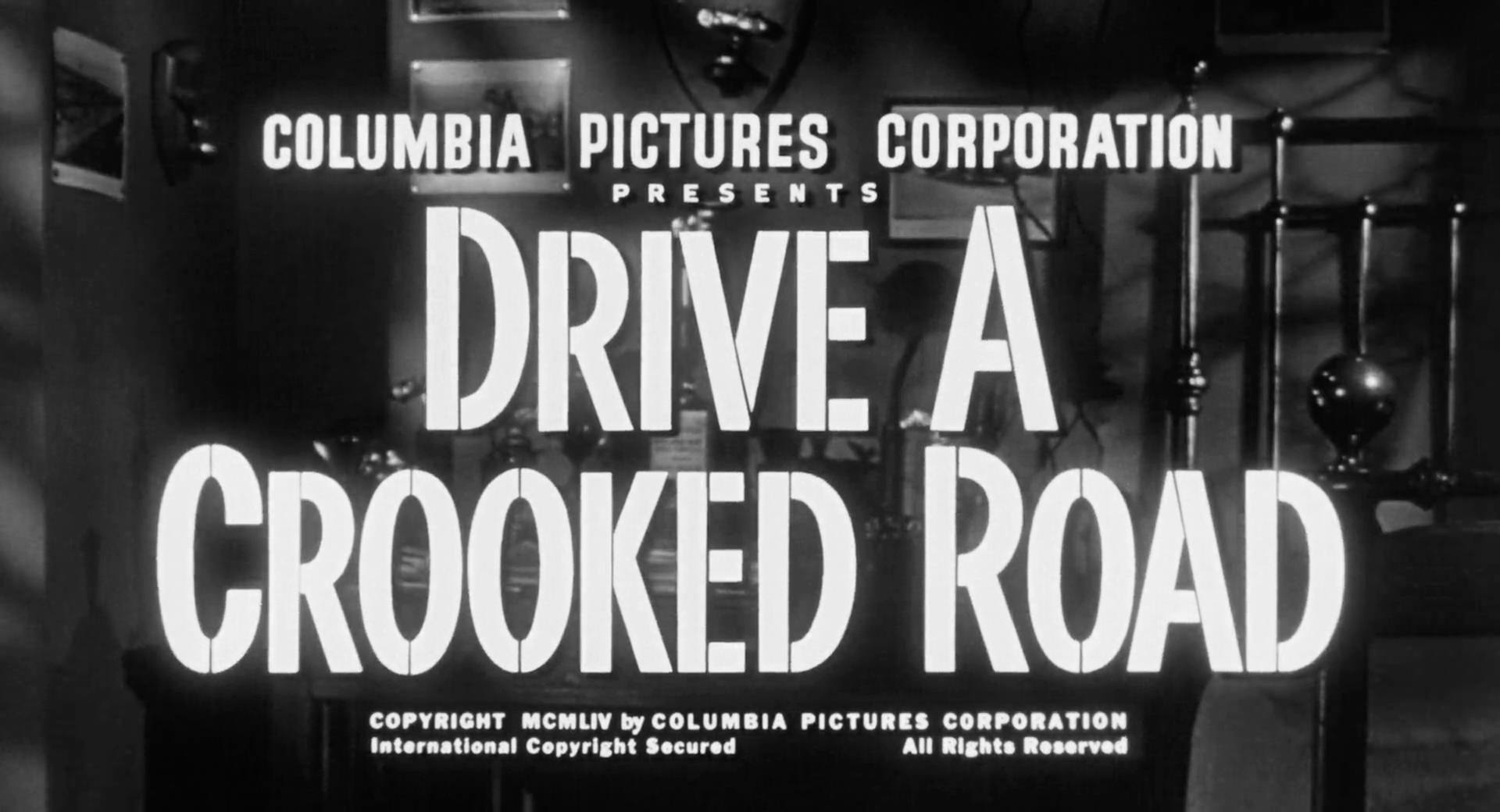 Drive A Crooked Road Title Card